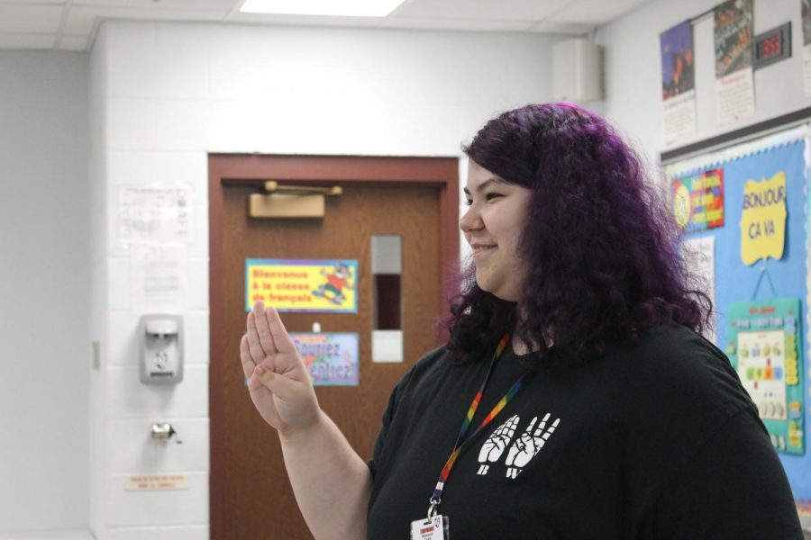 Sophomore Makayla Todd teaching the students Halloween related words at their Halloween event.