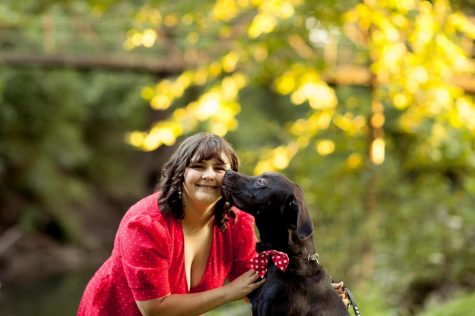 Cancer survivor Winter Racine with her service dog Aladdin.